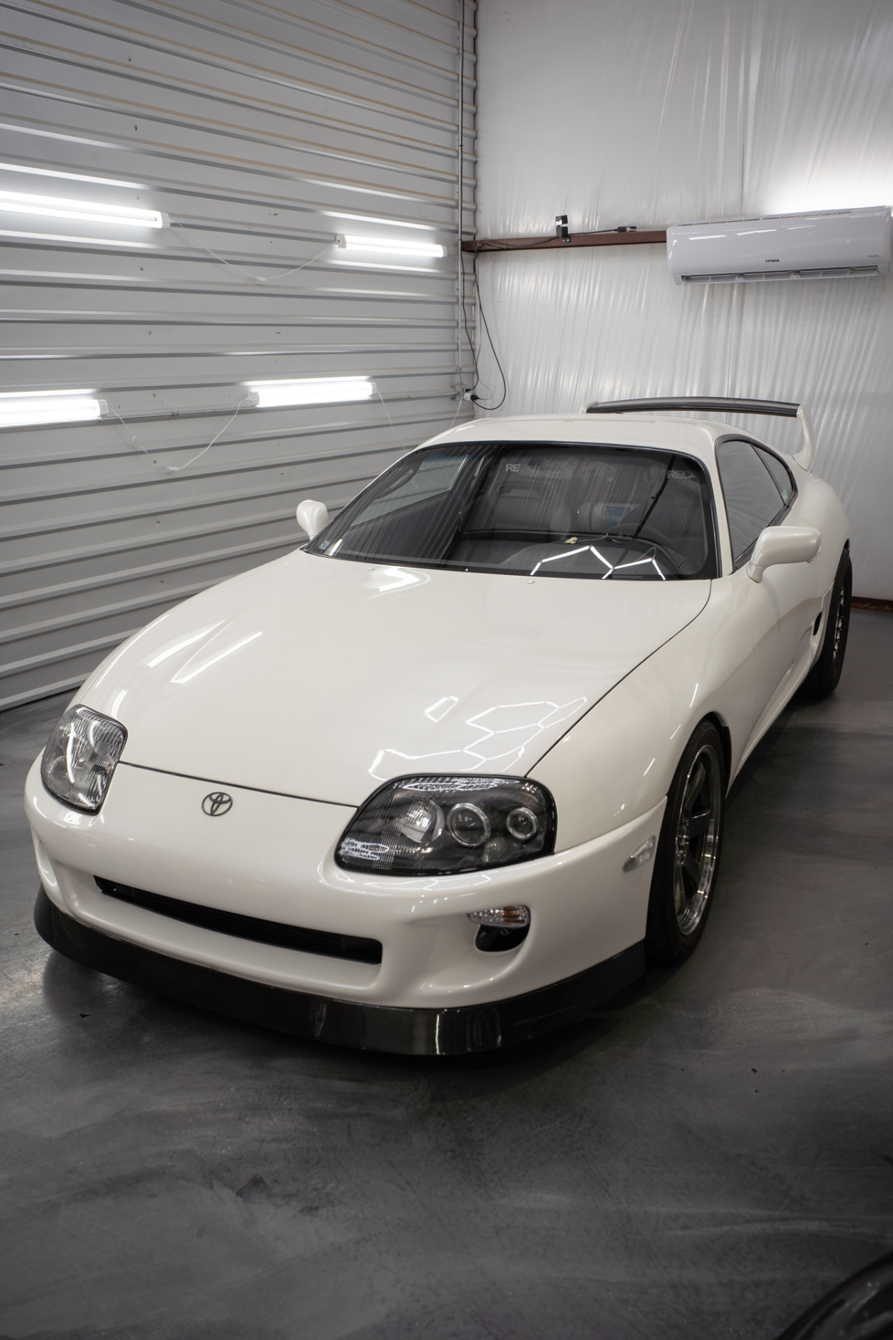 White Toyota Supra with corrected, polished paint at JJ’s Car Care in Terrell