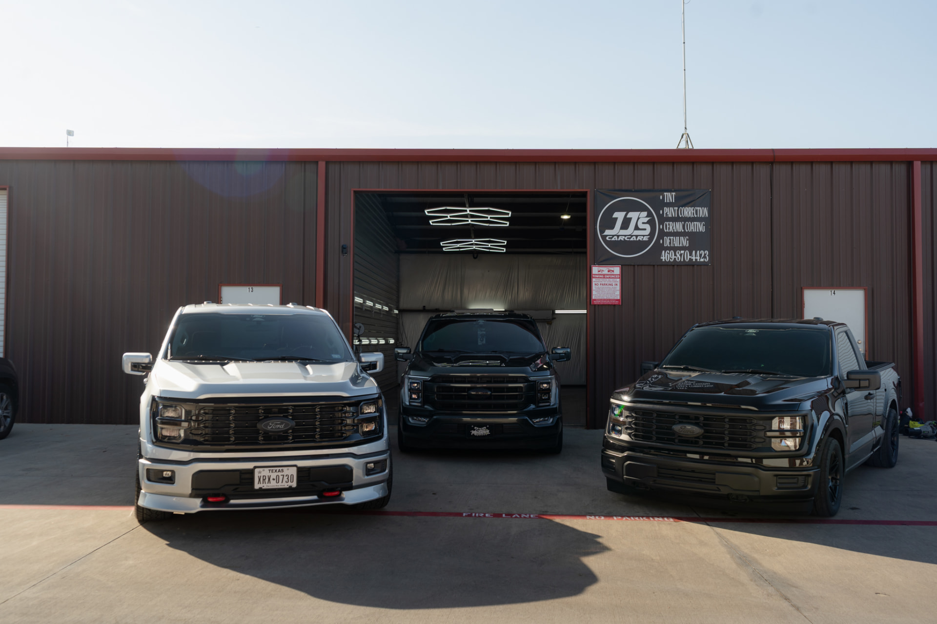 JJ’s Car Care shop front in Terrell, Texas, with trucks ready for window tint