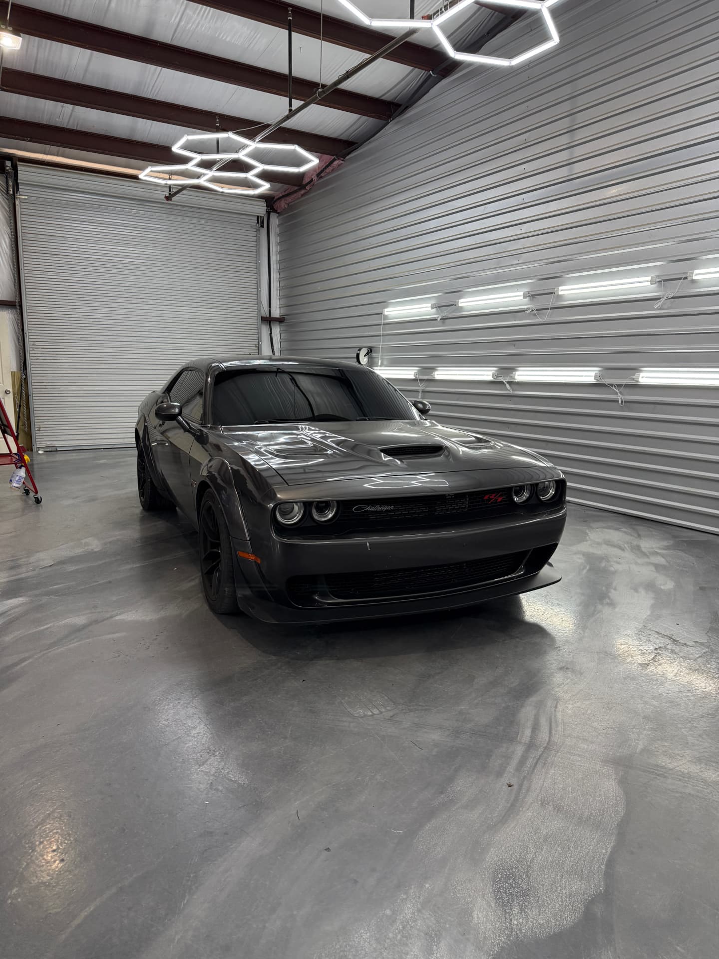 Grey Dodge Challenger with nano ceramic window tint under the shop lights at JJ’s Car Care in Terrell